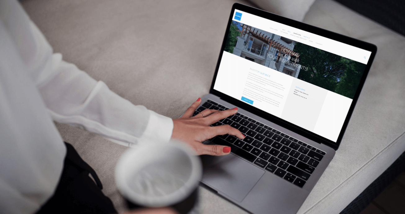 Di Jones Real Estate website being used by a woman on a laptop